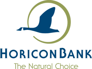 Logo of Horicon Bank featuring a blue bird silhouette inside a green circle, with the text "Horicon Bank" and slogan "The Natural Choice" below.